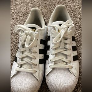 Adidas superstar shoes.
